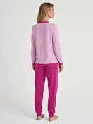 Women model is wearing Pyjama with cuff made of 100% Cotton in Pink, Patterned from the Cotton Special series by CALIDA, Back view