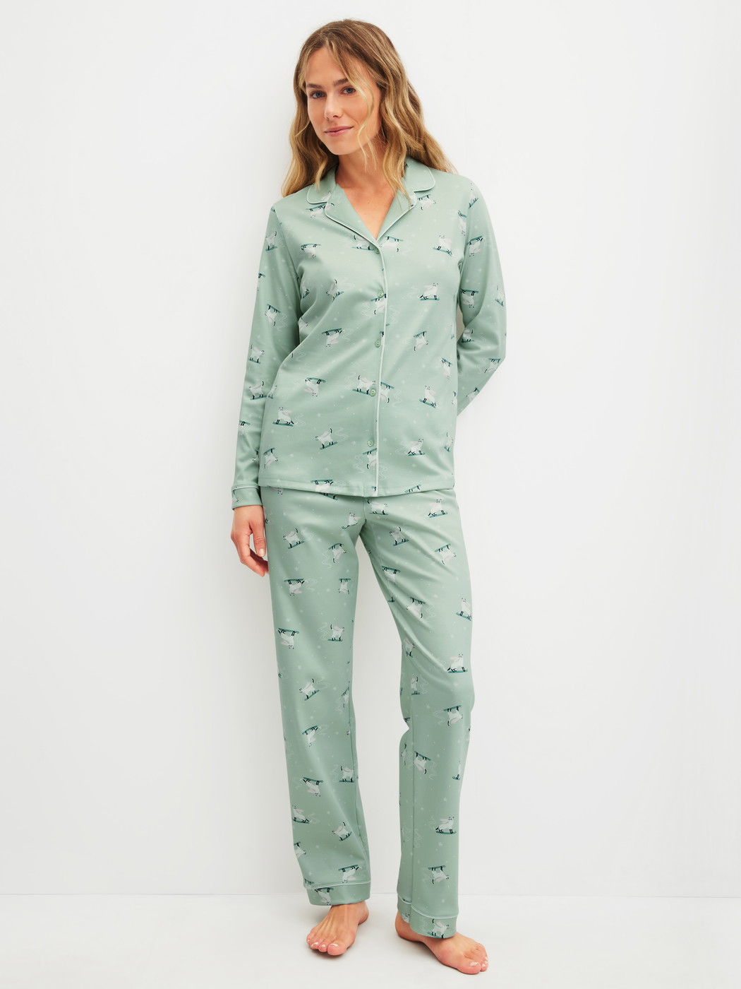 Women model is wearing Pyjamas, long made of 100% Cotton in Green, Motif from the Cat Dreams series by CALIDA, Front view