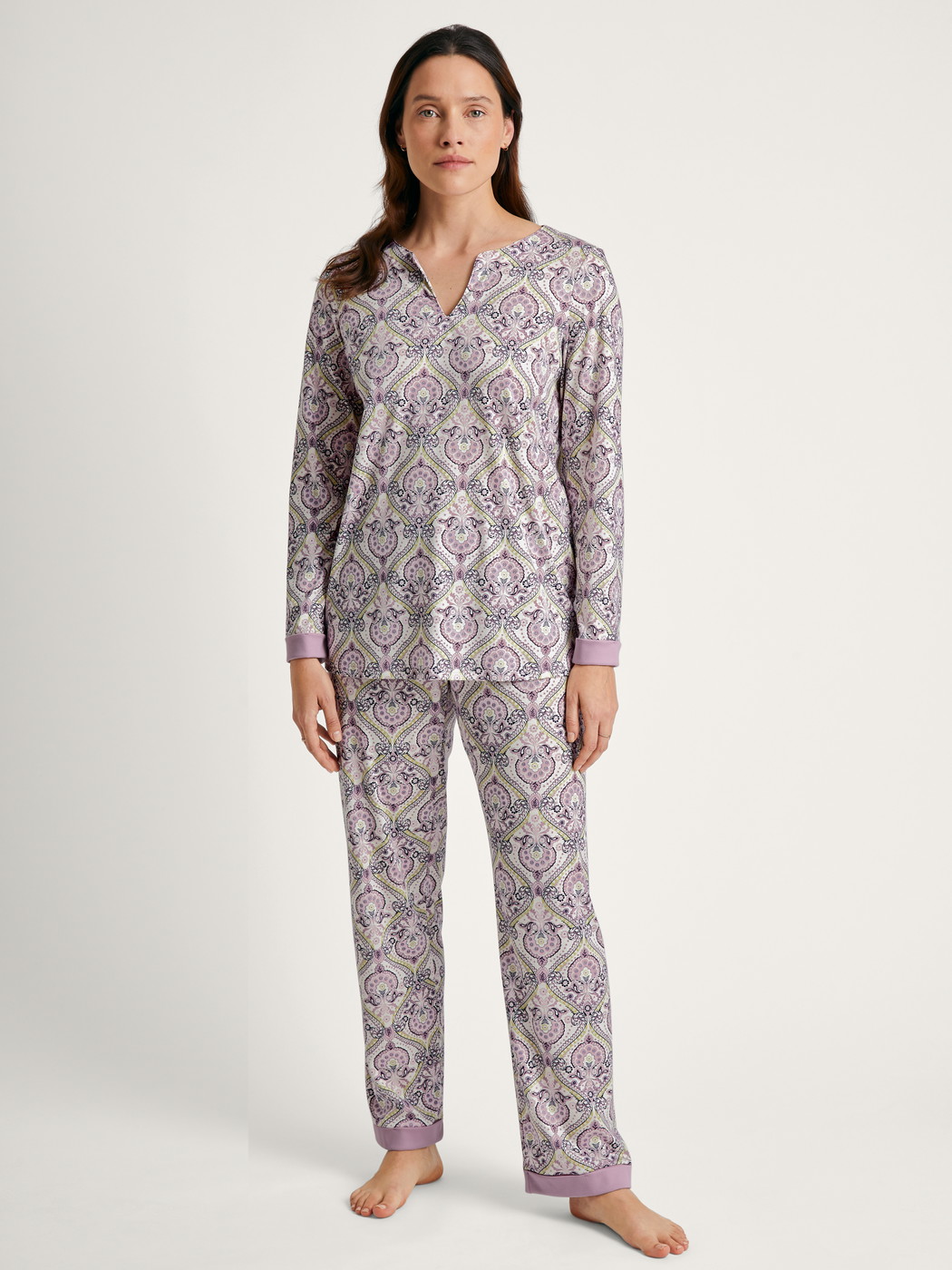 Women model is wearing Pyjama made of 100% Cotton in Purple, Floral from the Orient Dreams series by CALIDA, Front view
