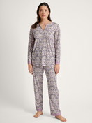 Women model is wearing Pyjama made of 100% Cotton in Purple, Floral from the Orient Dreams series by CALIDA, Front view