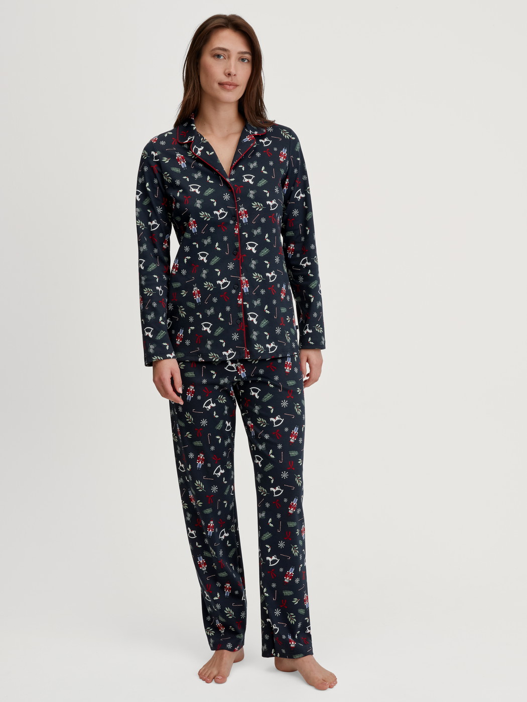 Women model is wearing Button-Up Pyjama made of 100% Cotton in Blue, Patterned from the Family & Friends series by CALIDA, Front view