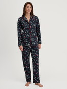 Women model is wearing Button-Up Pyjama made of 100% Cotton in Blue, Patterned from the Family & Friends series by CALIDA, Front view