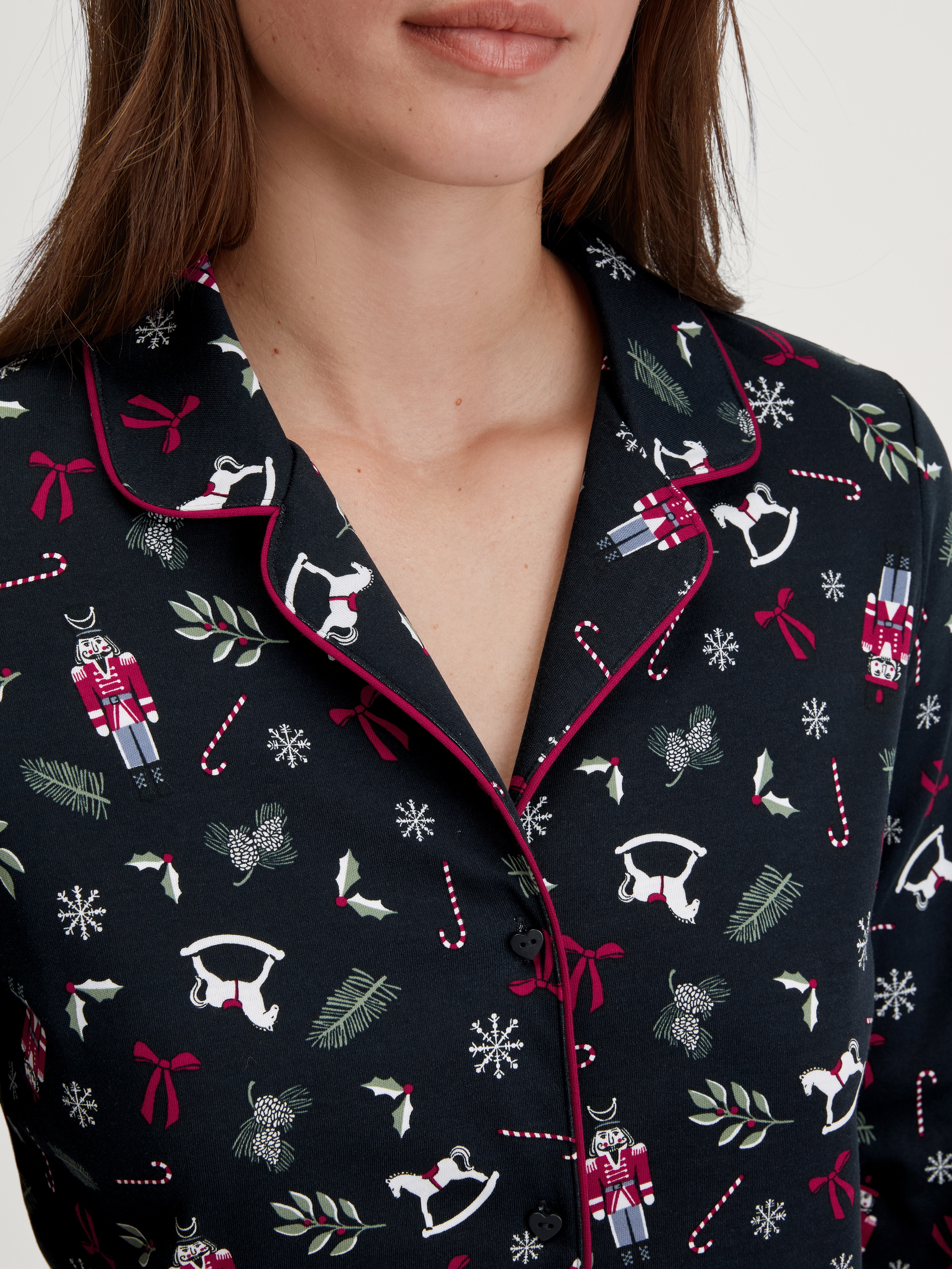 Women model is wearing Button-Up Pyjama made of 100% Cotton in Blue, Patterned from the Family & Friends series by CALIDA, Detail