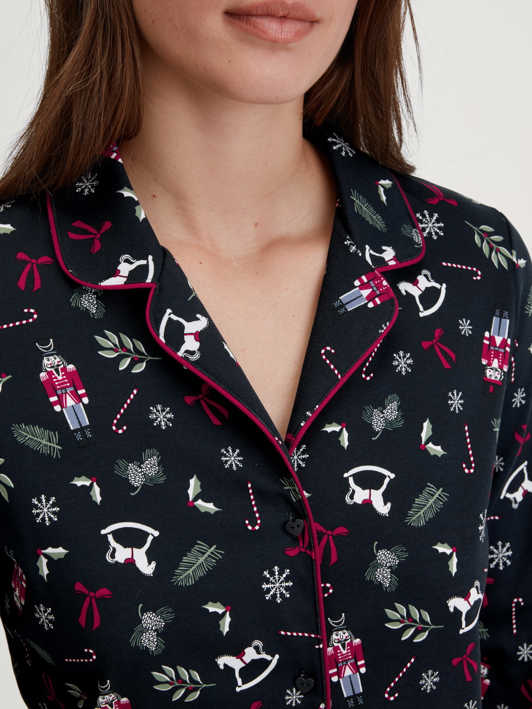 Women model is wearing Button-Up Pyjama made of 100% Cotton in Blue, Patterned from the Family & Friends series by CALIDA, Detail