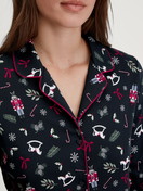 Women model is wearing Button-Up Pyjama made of 100% Cotton in Blue, Patterned from the Family & Friends series by CALIDA, Detail
