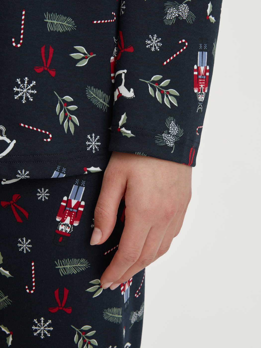 Women model is wearing Button-Up Pyjama made of 100% Cotton in Blue, Patterned from the Family & Friends series by CALIDA, Detail