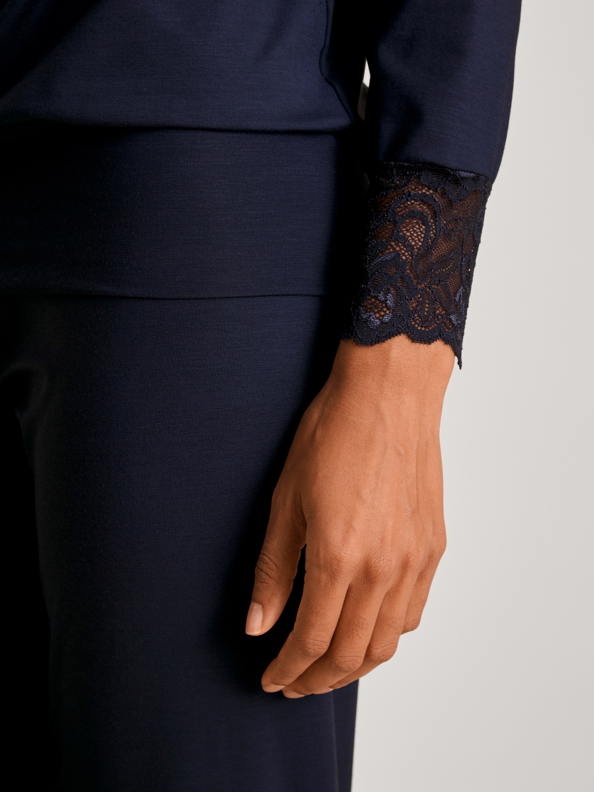 Women model is wearing Pyjama with cuff made of Modal in Blue, Lace from the Elegant Dreams series by CALIDA, Detail