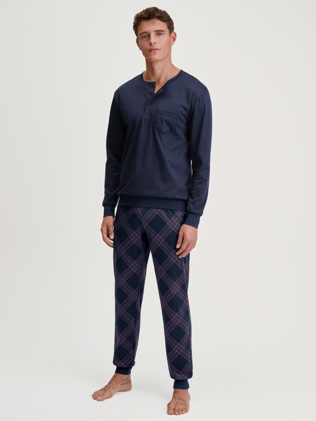 Men model is wearing Pyjama with cuff made of 100% Cotton in Blue, Patterned from the Relax Comfy 4 series by CALIDA, Front view