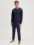 Men model is wearing Pyjama with cuff made of 100% Cotton in Blue, Patterned from the Relax Comfy 4 series by CALIDA, Front view