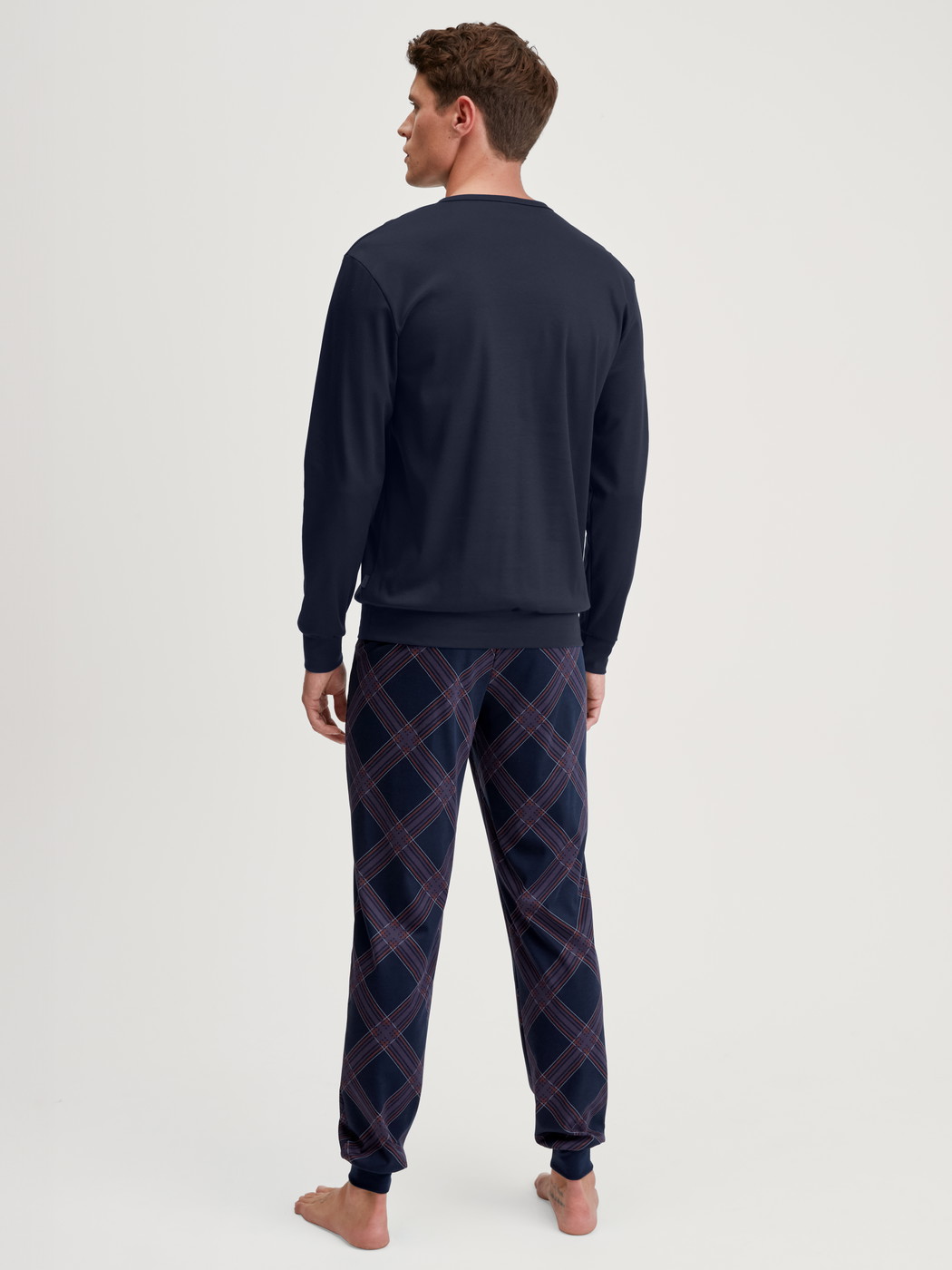 Men model is wearing Pyjama with cuff made of 100% Cotton in Blue, Patterned from the Relax Comfy 4 series by CALIDA, Back view