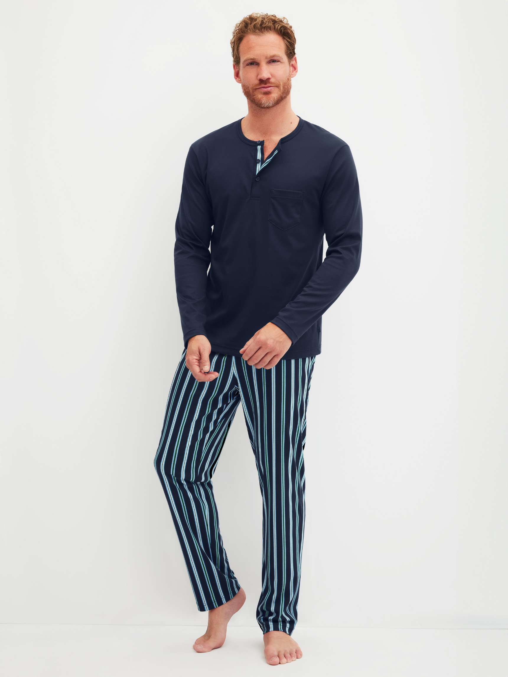 Men model is wearing Pyjama made of 100% Cotton in Blue, Striped from the Relax Choice series by CALIDA, Front view