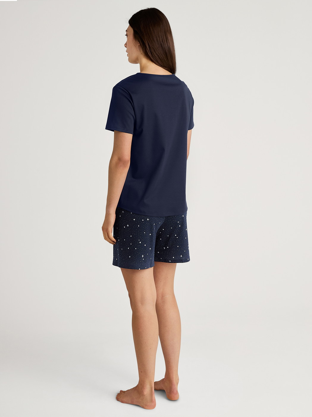 Women model is wearing Short pyjama made of 100% Cotton in Blue, Patterned from the Sweet Dreams series by CALIDA, Back view