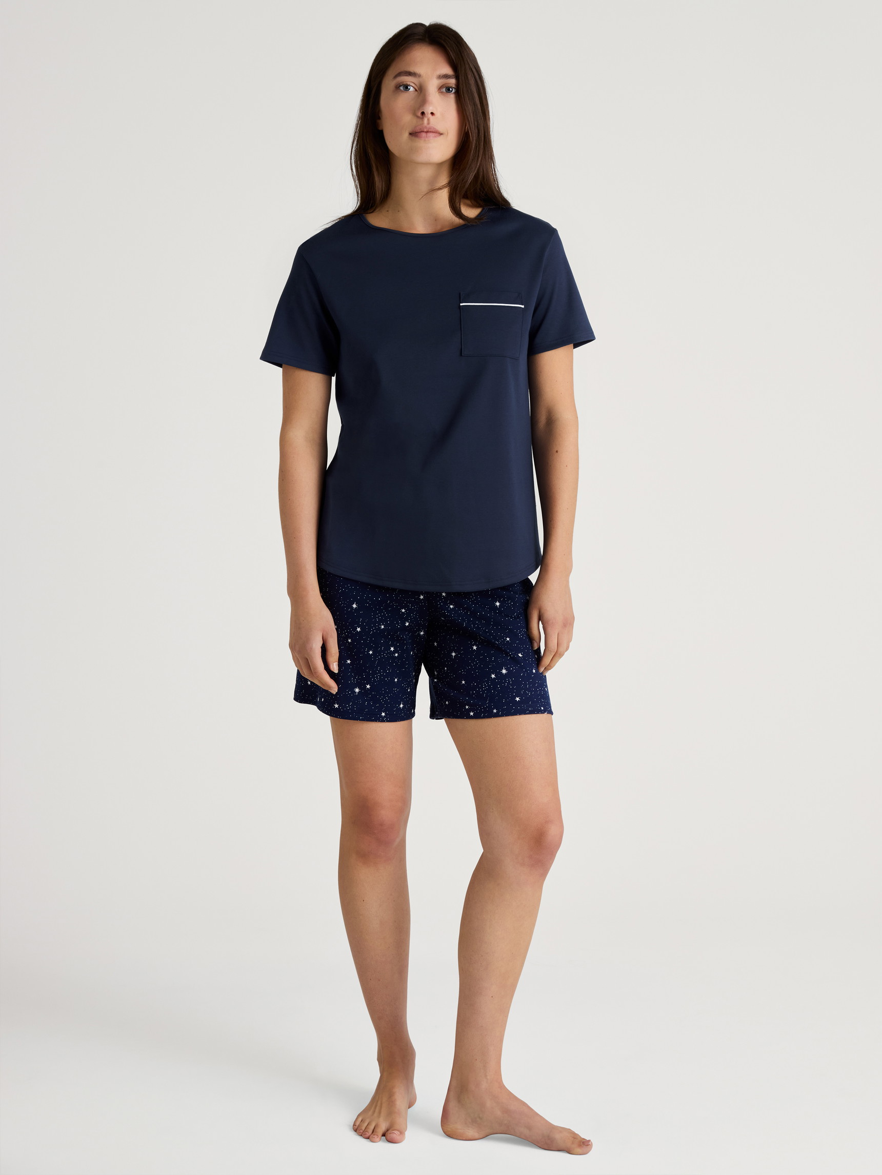 Women model is wearing Short pyjama made of 100% Cotton in Blue, Patterned from the Sweet Dreams series by CALIDA, Outfit