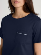 Women model is wearing Short pyjama made of 100% Cotton in Blue, Patterned from the Sweet Dreams series by CALIDA, Detail