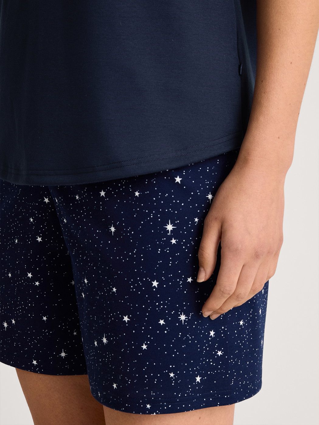 Women model is wearing Short pyjama made of 100% Cotton in Blue, Patterned from the Sweet Dreams series by CALIDA, Detail