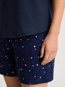 Women model is wearing Short pyjama made of 100% Cotton in Blue, Patterned from the Sweet Dreams series by CALIDA, Detail