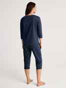 Women model is wearing 3/4 pyjama made of 100% Cotton in Blue, Motif from the Sweet Dreams series by CALIDA, Back view