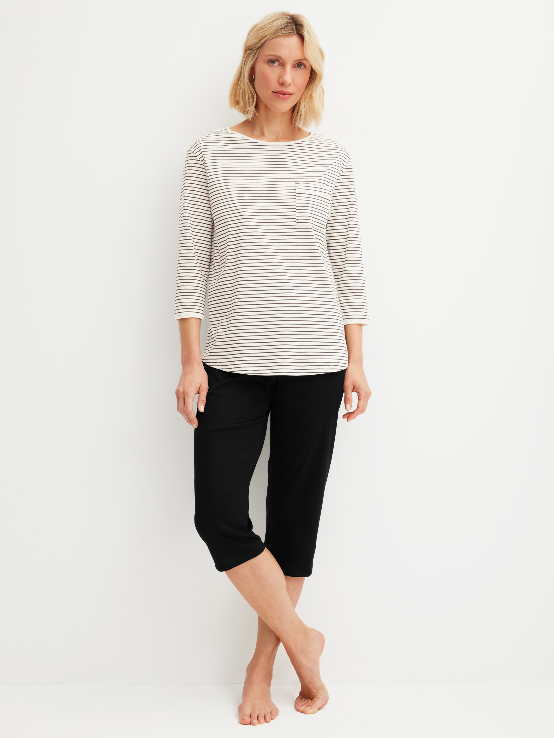 Women model is wearing 3/4 pyjama made of 100% Cotton in Beige, Striped from the Sweet Dreams series by CALIDA, Front view