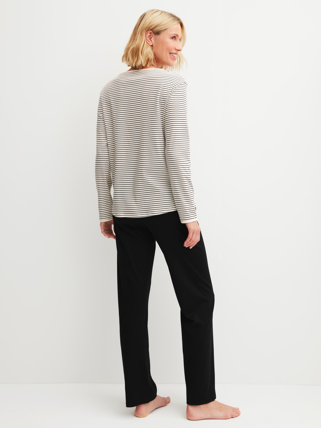 Women model is wearing Pyjamas, long made of 100% Cotton in Beige, Striped from the Sweet Dreams series by CALIDA, Back view