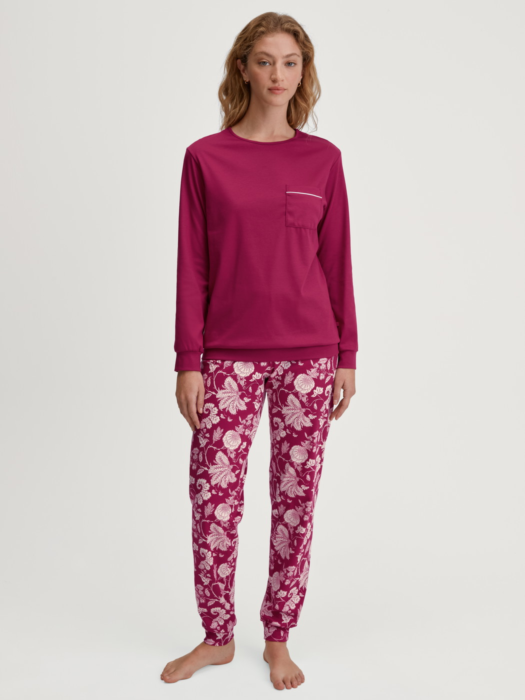 Women model is wearing Pyjama with cuff made of 100% Cotton in Purple, Floral from the Sweet Dreams series by CALIDA, Front view