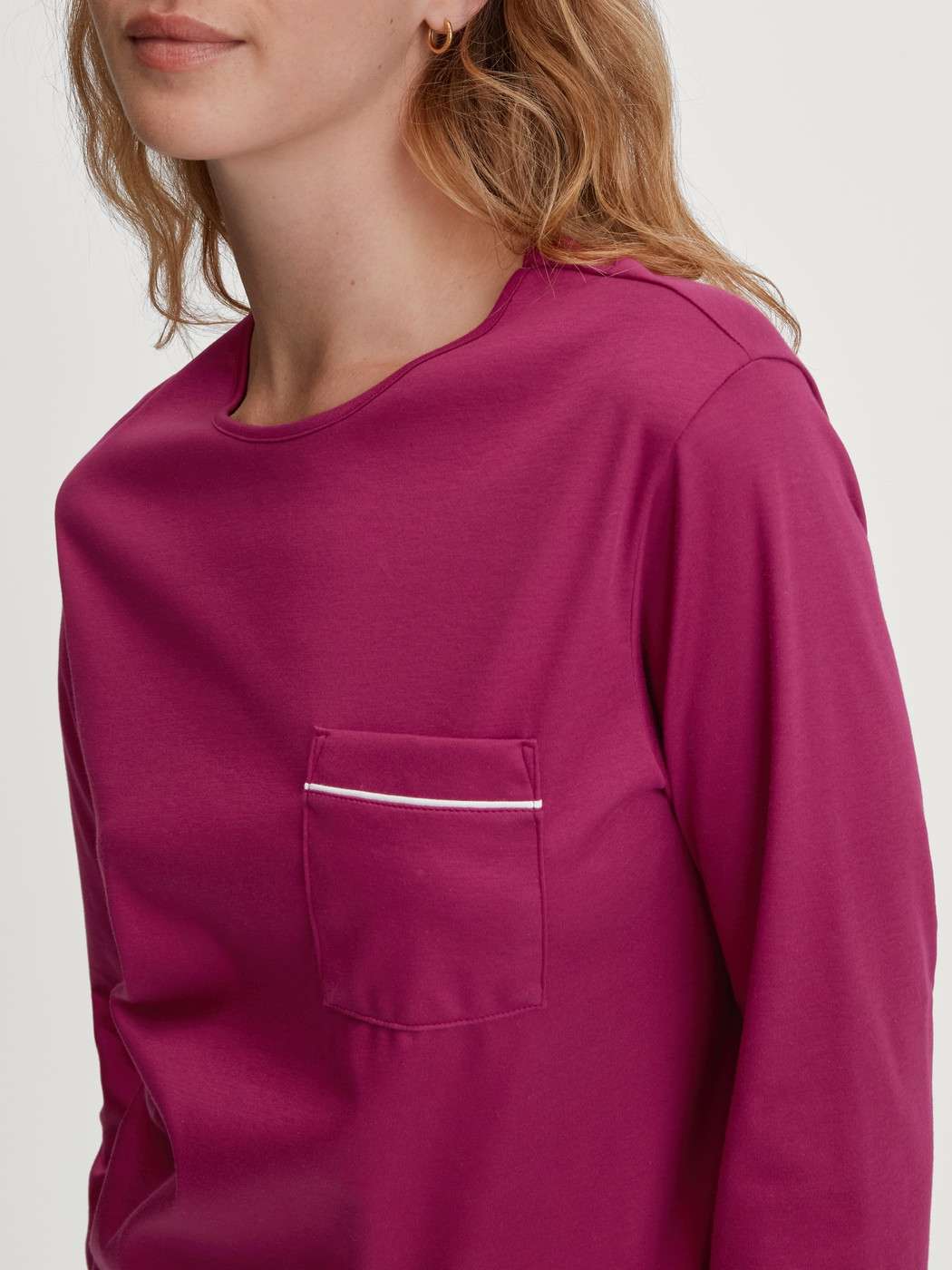 Women model is wearing Pyjama with cuff made of 100% Cotton in Purple, Floral from the Sweet Dreams series by CALIDA, Detail