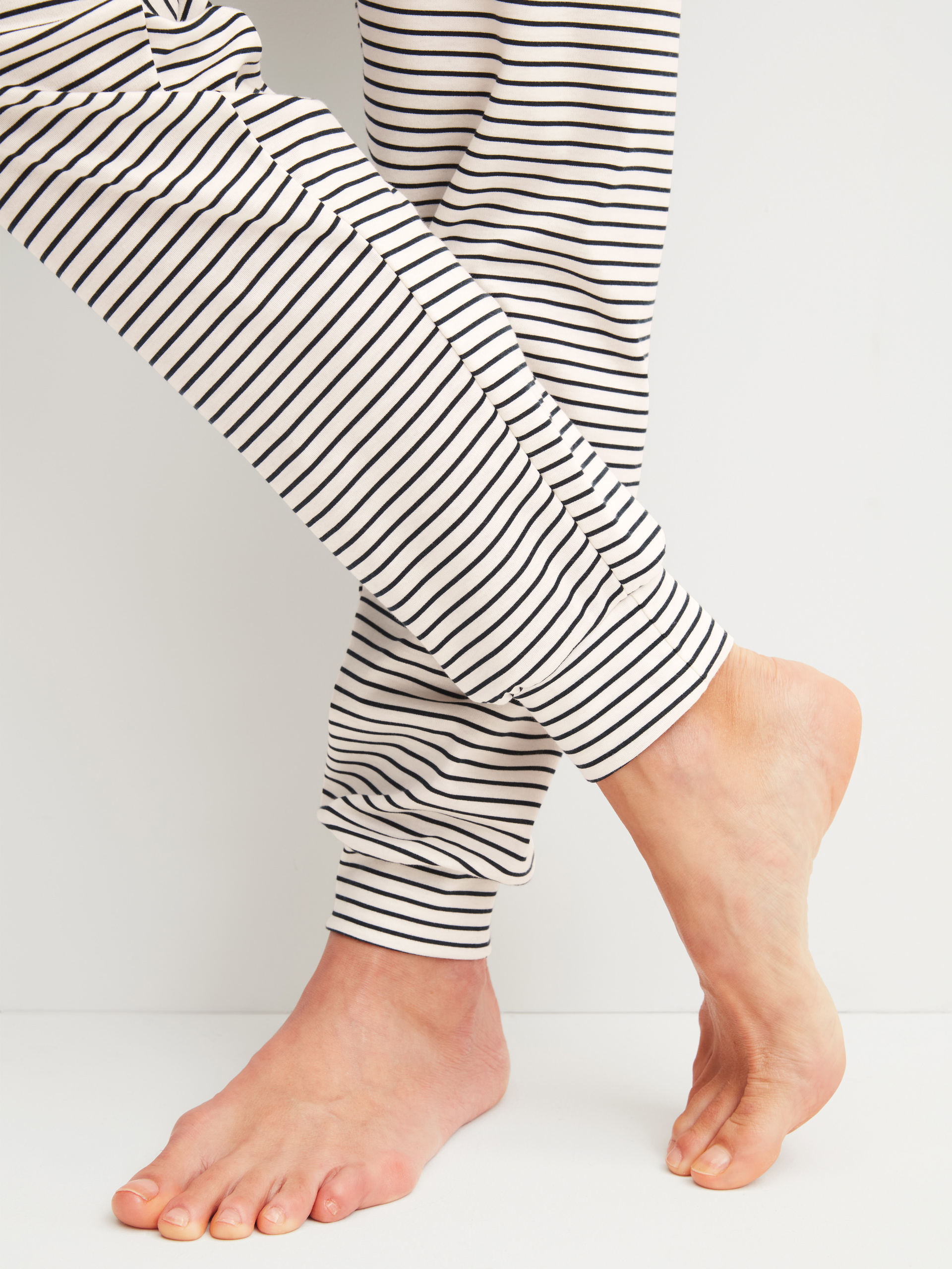 Women model is wearing Pyjama with cuff made of 100% Cotton in Beige, Striped from the Sweet Dreams series by CALIDA, Detail