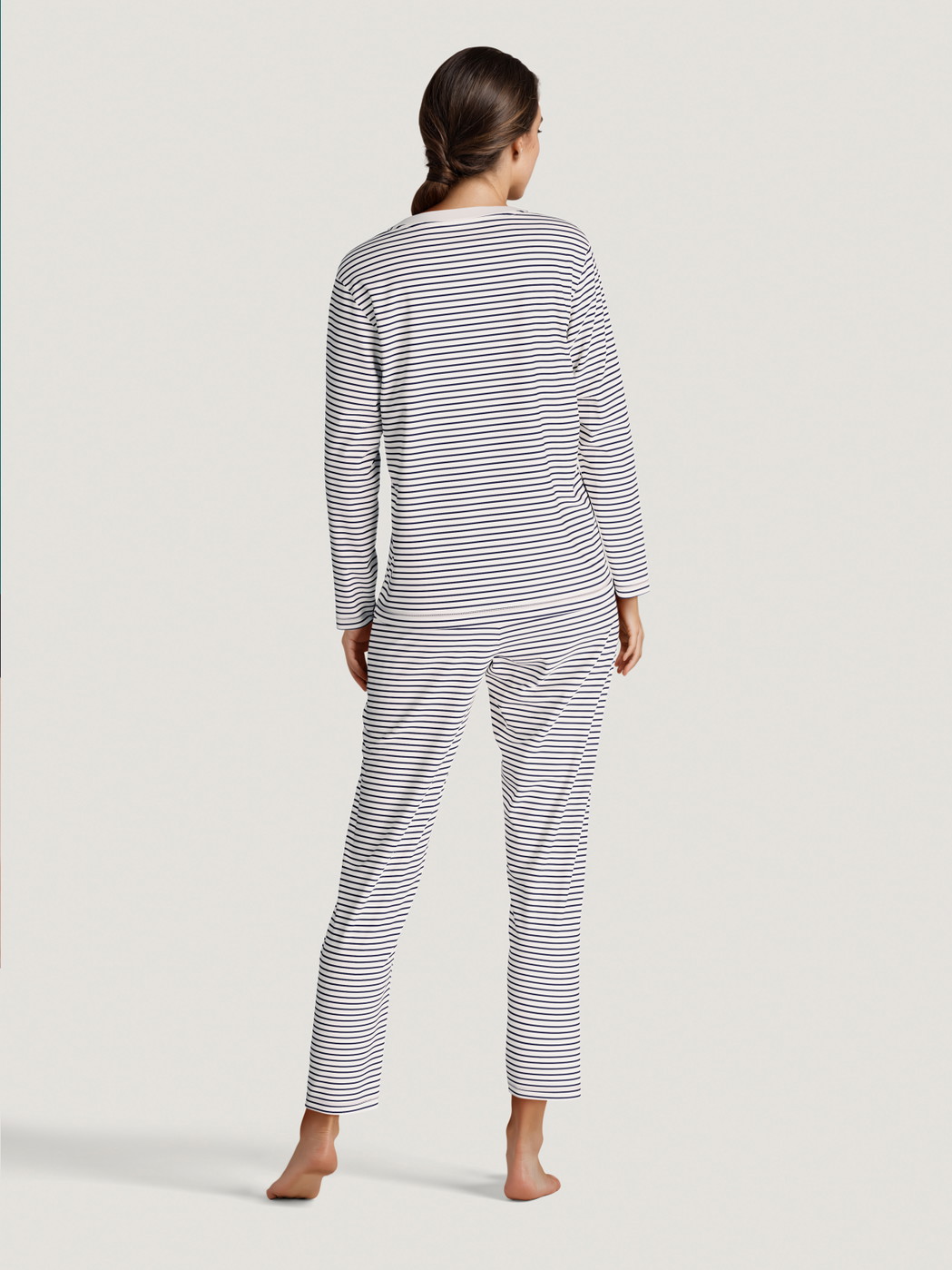 Women model is wearing Pyjama made of 100% Cotton in Blue, Striped from the Season Special series by CALIDA, Back view, AI-generated image