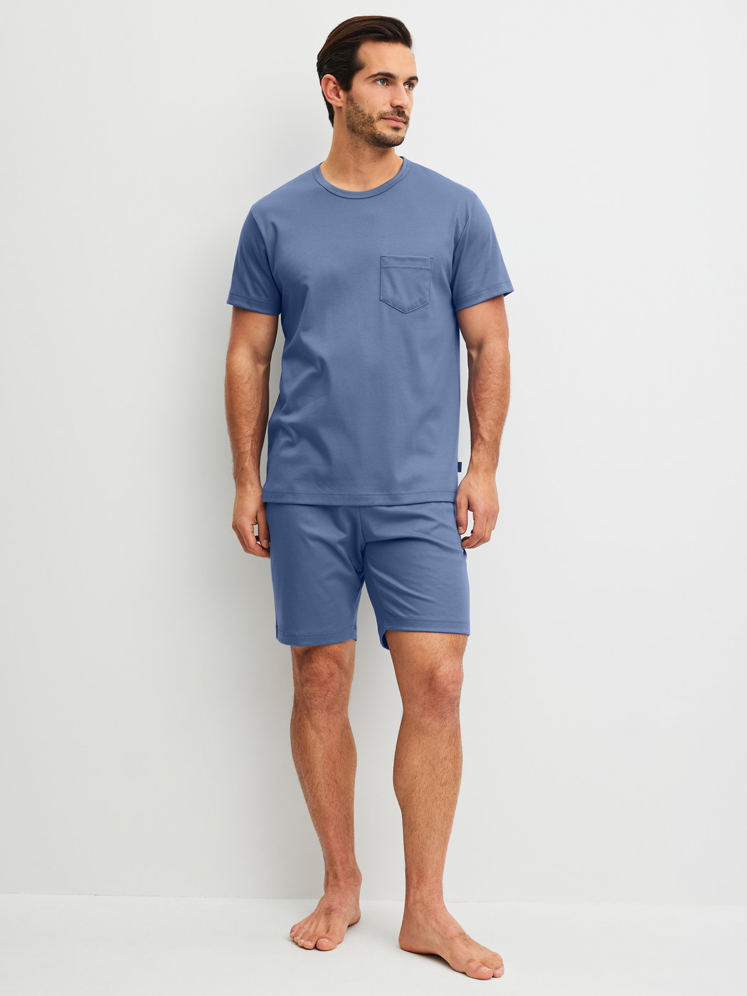 Men model is wearing Short pyjama made of 100% Cotton in Blue, Unicoloured from the Relax Choice 1 series by CALIDA, Front view