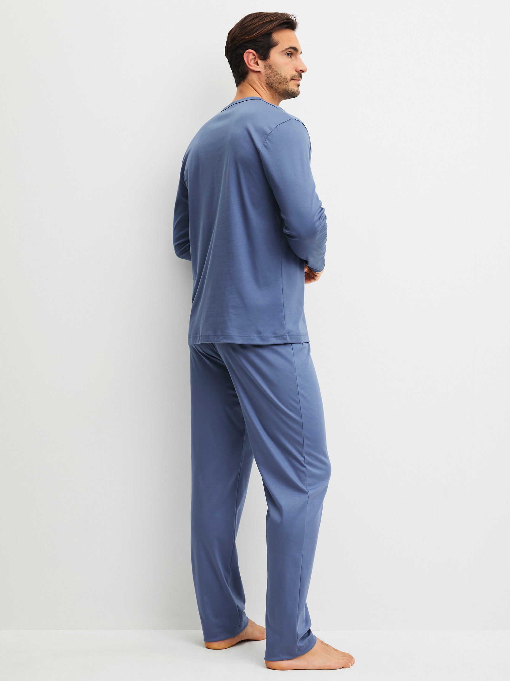 Men model is wearing Pyjamas, long made of 100% Cotton in Blue, Unicoloured from the Relax Choice 1 series by CALIDA, Back view