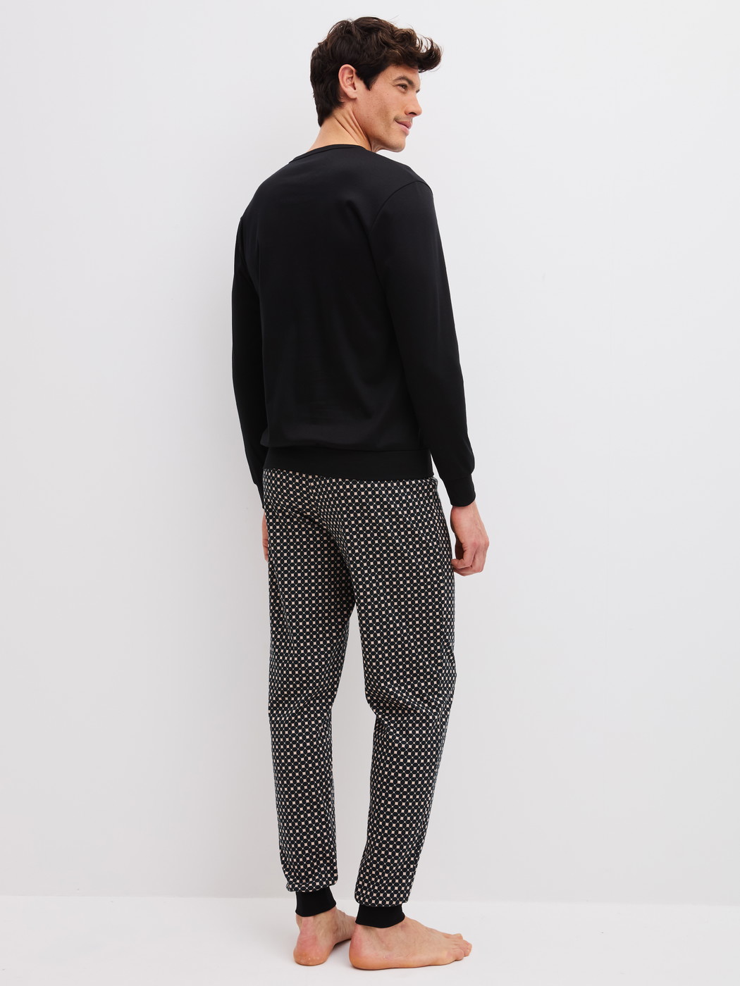 Men model is wearing  made of 100% Cotton in Black, Patterned from the Relax Cosy Vibes 4 series by CALIDA, Back view