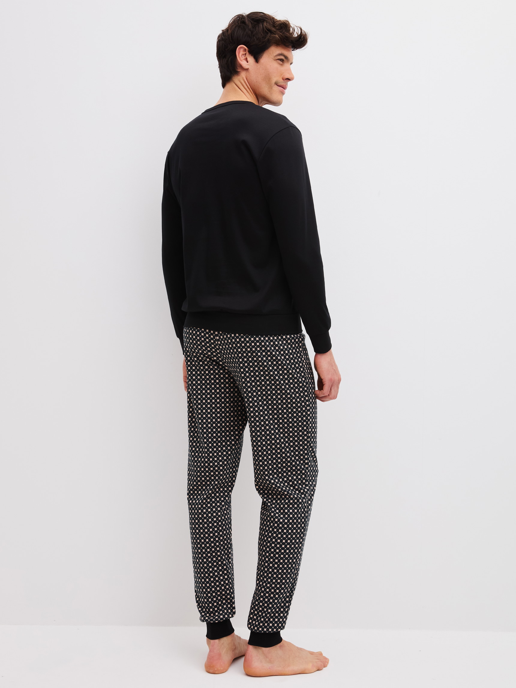 Men model is wearing  made of 100% Cotton in Black, Patterned from the Relax Cosy Vibes 4 series by CALIDA, Back view