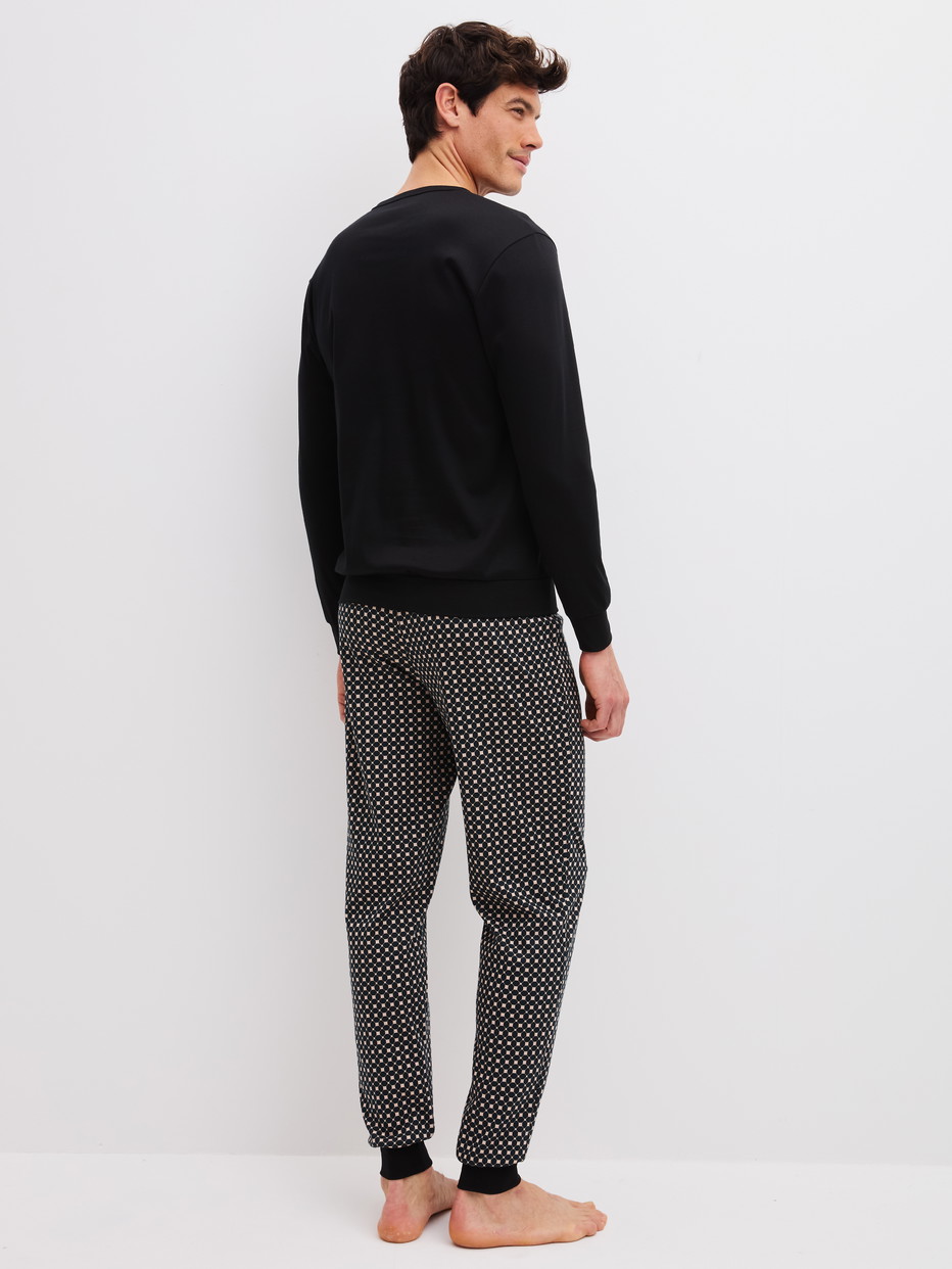 Men model is wearing  made of 100% Cotton in Black, Patterned from the Relax Cosy Vibes 4 series by CALIDA, Back view