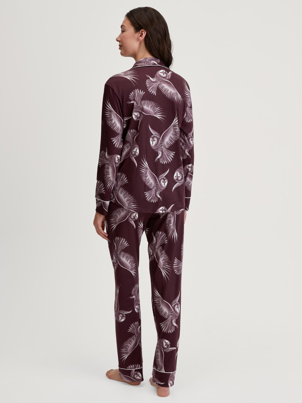Women model is wearing Button-through pyjamas made from TENCEL™ modal and silk made of Modal in Red, Floral from the Moonlight Dreams series by CALIDA, Back view