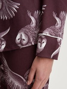 Women model is wearing Button-through pyjamas made from TENCEL™ modal and silk made of Modal in Red, Floral from the Moonlight Dreams series by CALIDA, Detail
