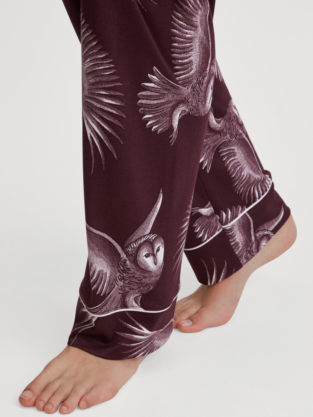 Women model is wearing Button-through pyjamas made from TENCEL™ modal and silk made of Modal in Red, Floral from the Moonlight Dreams series by CALIDA, Detail