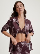 Women model is wearing Button-through pyjamas made from TENCEL™ modal and silk made of Modal in Red, Floral from the Moonlight Dreams series by CALIDA, Front view
