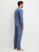 Men model is wearing Pyjamas with buttons made of 100% Cotton in Blue, Unicoloured from the Relax Choice 1 series by CALIDA, Back view