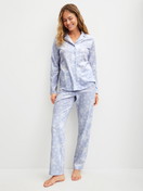 Women model is wearing Button-Up Pyjama made of 100% Cotton in Blue, Patterned from the Cosy Nights series by CALIDA, Front view