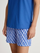 Women model is wearing Short pyjama made of 100% Cotton in Blue, Patterned from the Shell Nights series by CALIDA, Detail