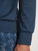Men model is wearing Pyjama with cuff made of 100% Cotton in Blue, Patterned from the Nightwear Xtra series by CALIDA, Detail