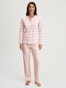 Women model is wearing Pyjamas, long made of 100% Cotton in Pink, Floral from the Midnight Flowers series by CALIDA, Front view