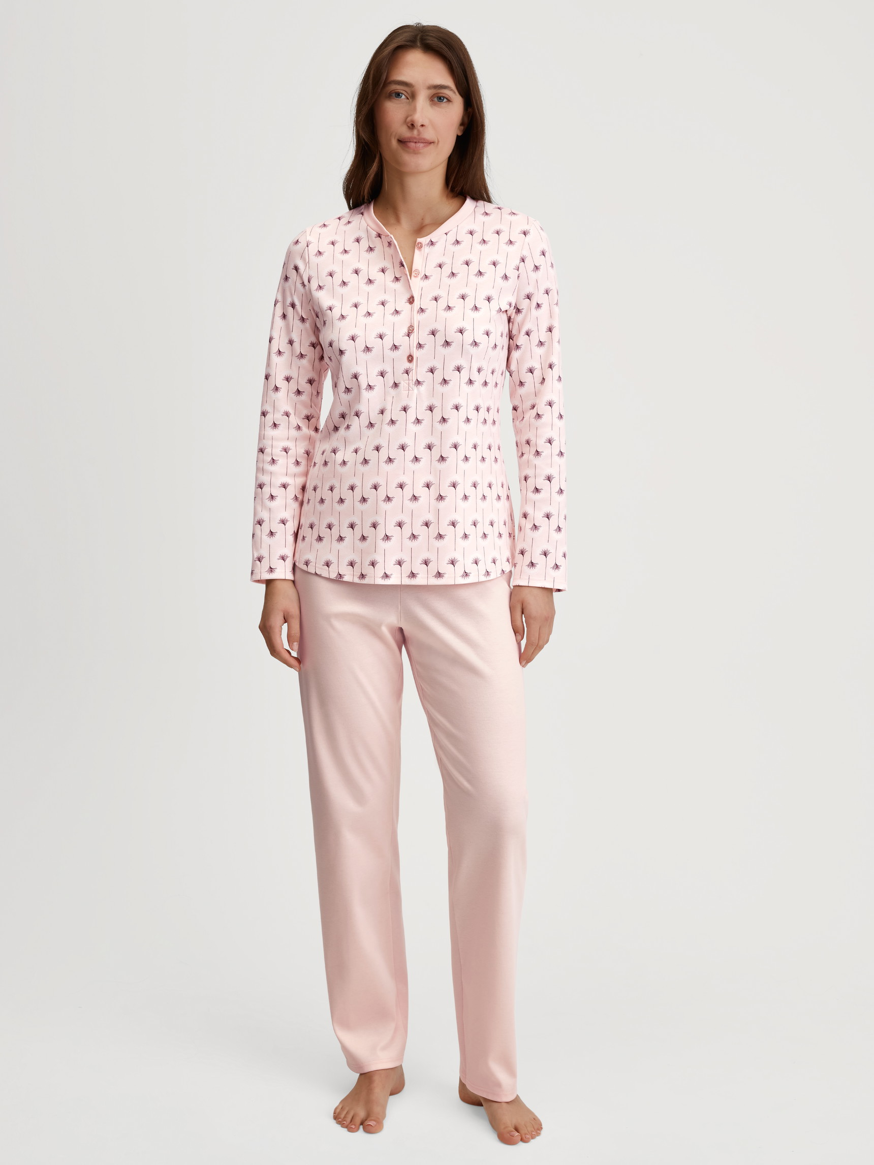 Women model is wearing Pyjamas, long made of 100% Cotton in Pink, Floral from the Midnight Flowers series by CALIDA, Front view
