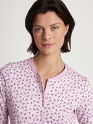 Women model is wearing Pyjamas, long made of 100% Cotton in Purple, Floral from the Midnight Flowers series by CALIDA, Detail