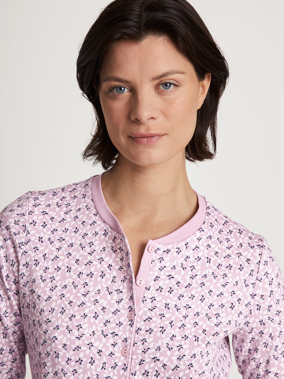 Women model is wearing Pyjamas, long made of 100% Cotton in Purple, Floral from the Midnight Flowers series by CALIDA, Detail