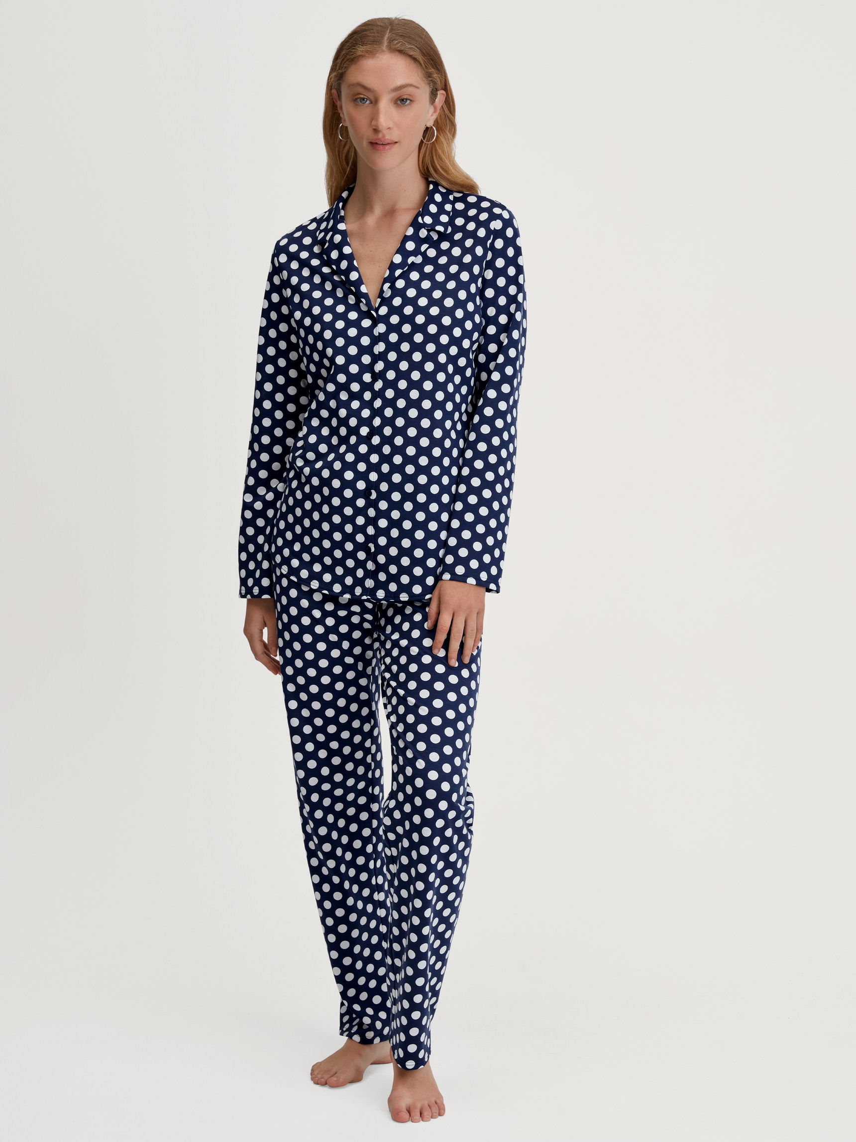Women model is wearing Pyjamas, buttoned through made of 100% Cotton in Blue, Patterned from the Cotton Special series by CALIDA, Front view