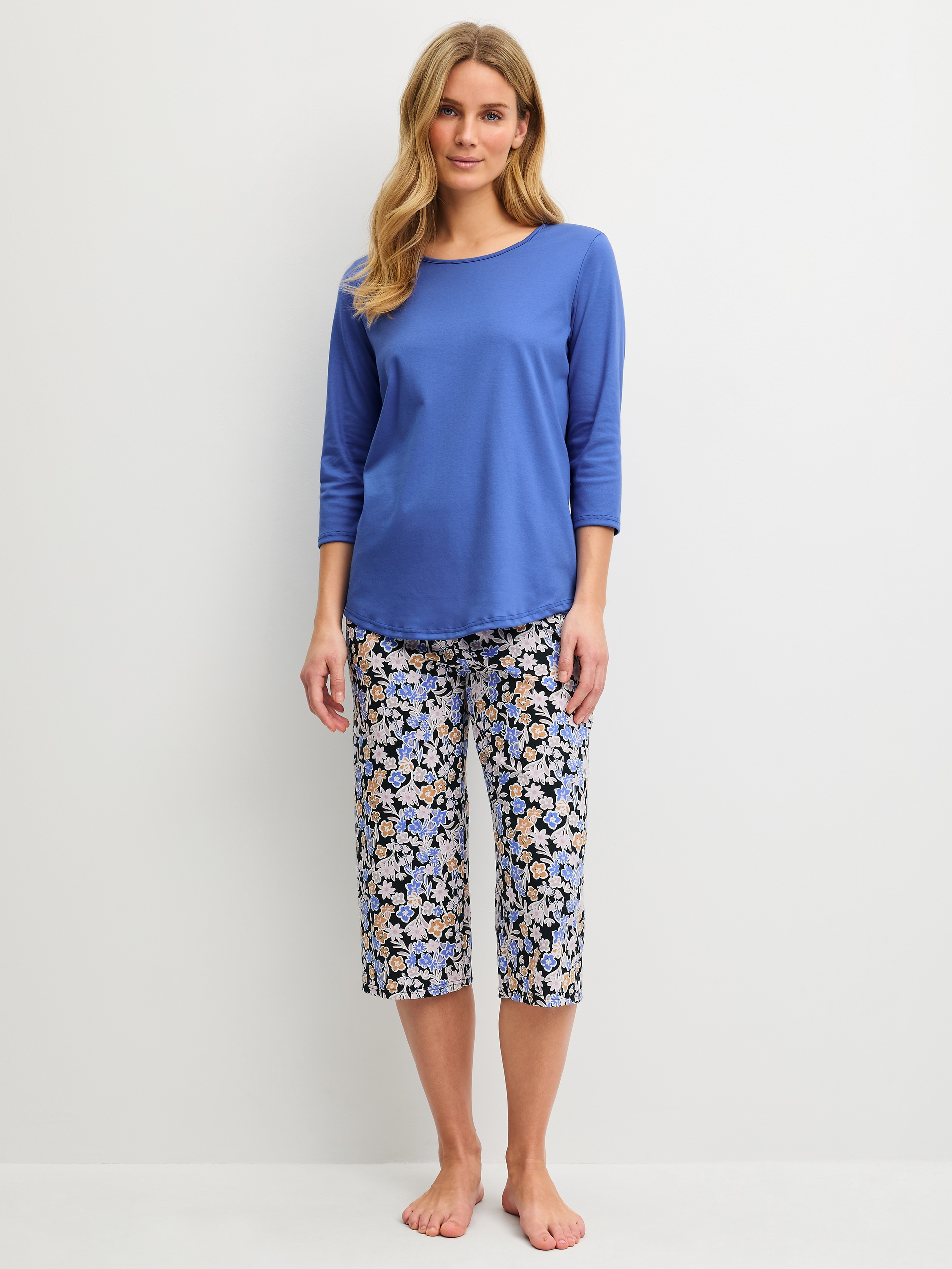 Women model is wearing  made of 100% Cotton in Blue, Patterned from the Flower Dreams series by CALIDA, Front view