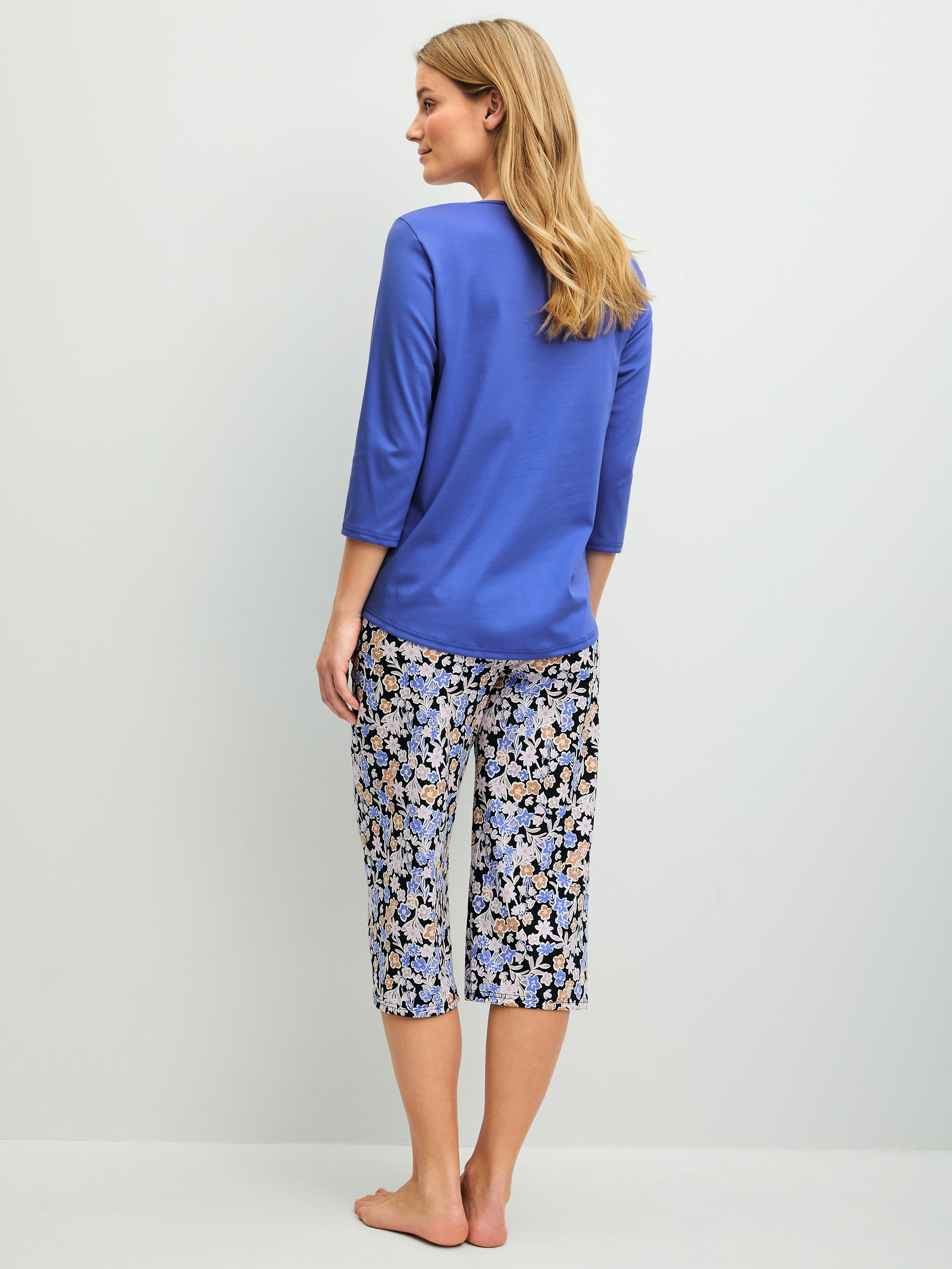 Women model is wearing  made of 100% Cotton in Blue, Patterned from the Flower Dreams series by CALIDA, Back view