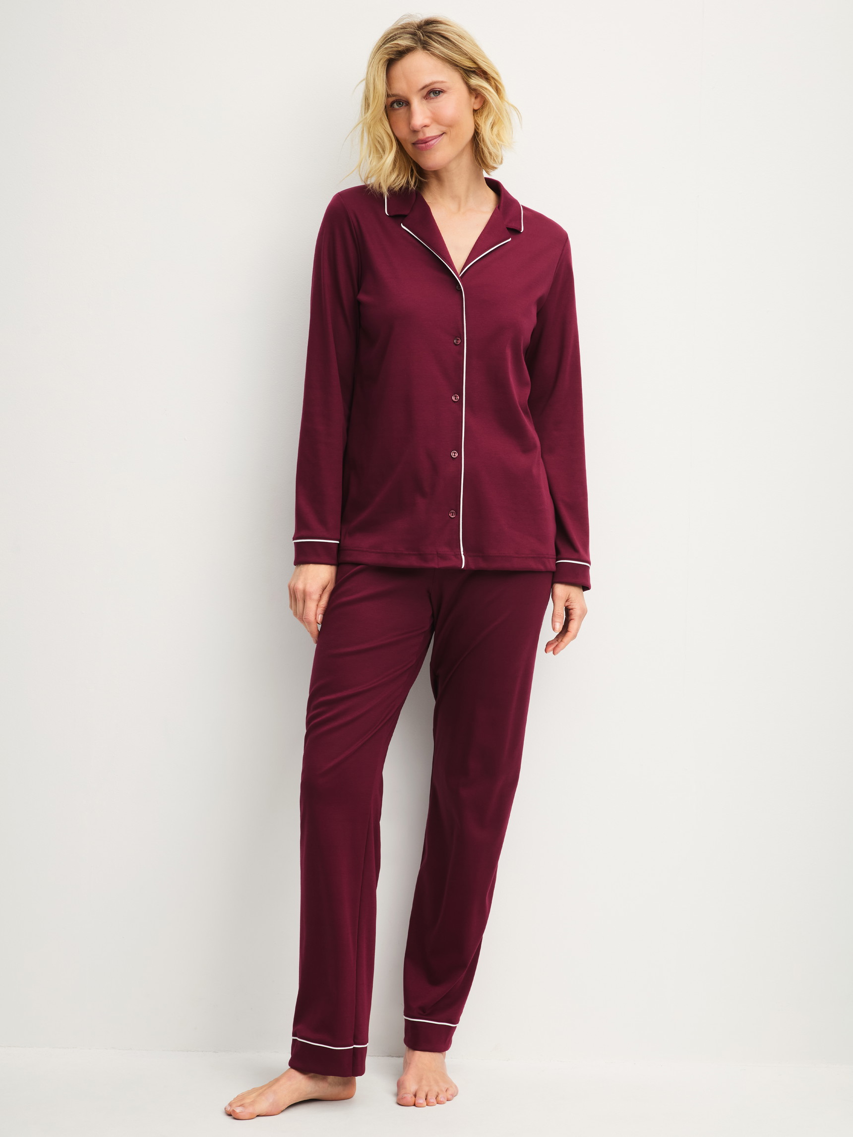 Women model is wearing Button-Up Pyjama made of Swiss+Cotton in Red, Unicoloured from the Season Special series by CALIDA, Front view