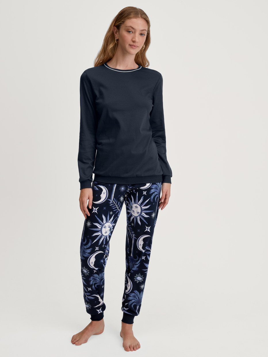 Women model is wearing Pyjama with cuff made of 100% Cotton in Blue, Patterned from the Winter Dreams series by CALIDA, Front view