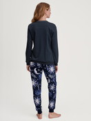 Women model is wearing Pyjama with cuff made of 100% Cotton in Blue, Patterned from the Winter Dreams series by CALIDA, Back view